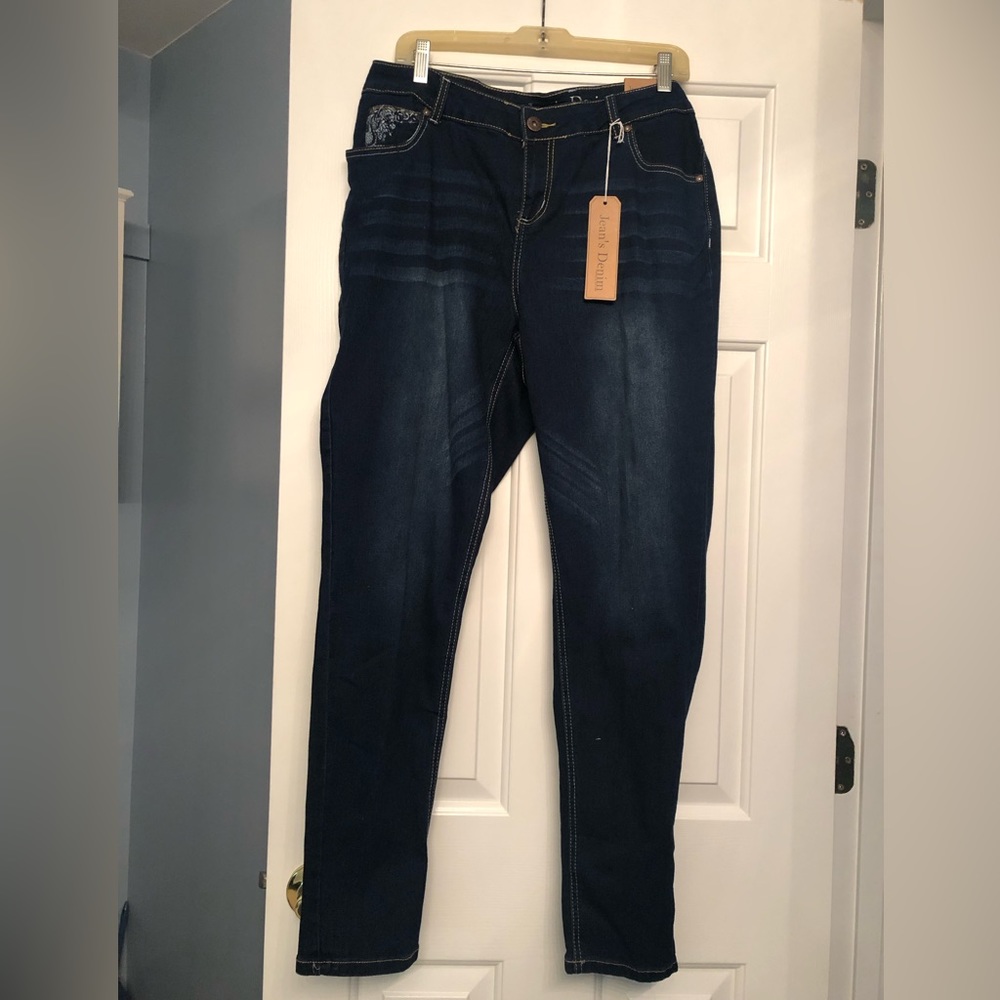 Jean’s Denim jeans with embellishments on front and back pockets, size 14W.
